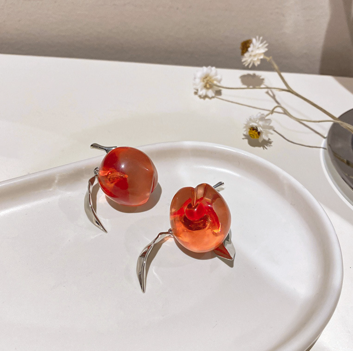 Asymmetric acrylic peach earrings